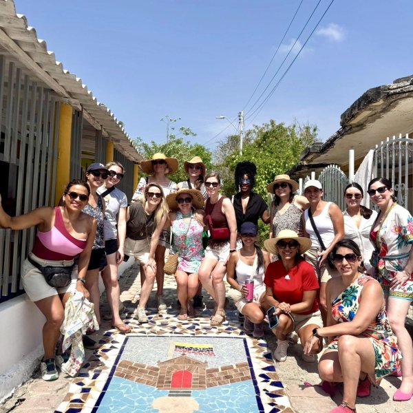AIJA Women Network members by a street mosaic